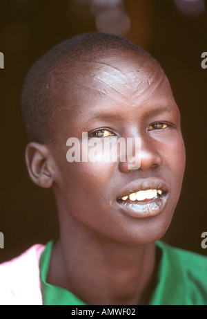 In the southern Sudan a Dinka youth is lightly marked with tribal scars on his forehead Stock Photo