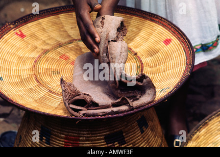 Ethiopia's national dish, injera and wat, stewed meat, starts with a basket-sized foamy brown pancake of injera made from teff Stock Photo