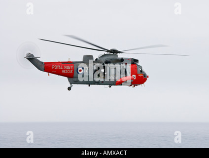 royal navy sea king rescue helicopter no 17 on patrol over the english south coast Stock Photo