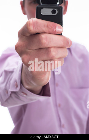 Businessman using a the camera function on his mobile phone extreme close up on phone isolated against a white background Stock Photo