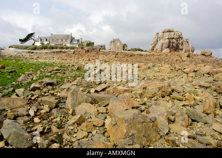 Cottage on beach, Pointe du Chateau, Cote de Granit Rose, Brittany, France Stock Photo