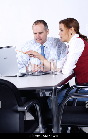 Two businesspeople looking at laptop Stock Photo