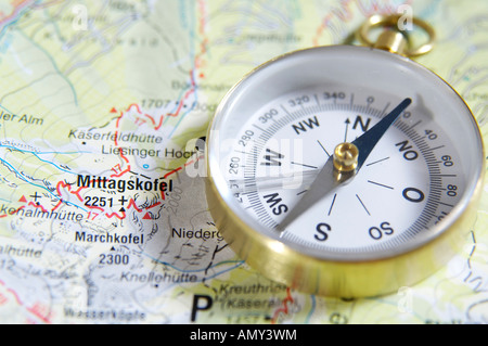 High angle view of compass on map Stock Photo