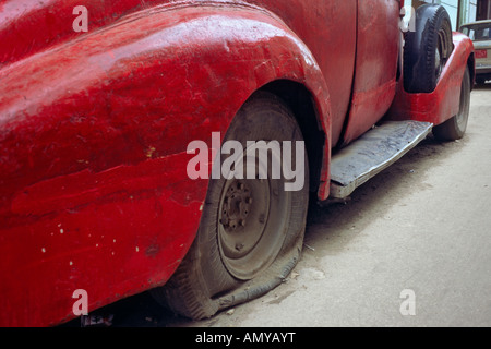 A classic, vintage automobile painted in candy apple red, parked in the Old  Town part of the city of Havana, Cuba Stock Photo - Alamy