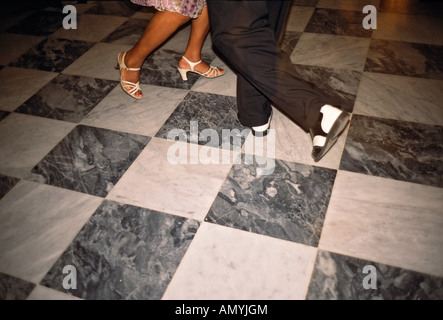 Feet and legs of a Cuban couple dancing salsa to a band in the lounge of the Hotel La Florida in Habana Vieja Old Havana Stock Photo