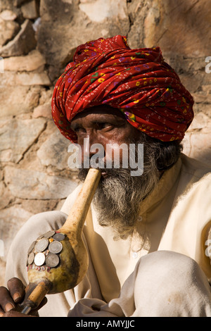 Snake charmer playing his flute in Jaipur in Rajasthan India Stock Photo