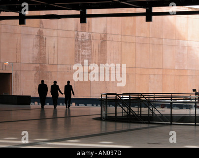 Silhouette of three businessmen walking in Broadgate centre , City of London Stock Photo