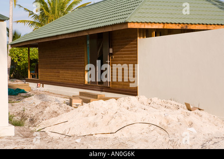 Maldives Addu Atoll Herathera Resort Jacuzzi Beach Villas builders waste blocking path Stock Photo