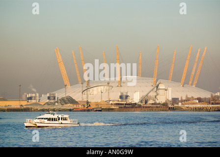 the Thames Clipper passenger commuter service on the River Thames in front of the Millennium 02 Dome London Stock Photo