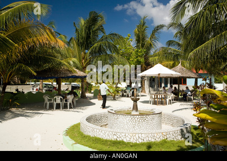 Maldives Addu Atoll Hulumidu Midu town outdoor cafe near harbour dried up fountain Stock Photo