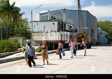 Maldives Addu Atoll Gan Equator Village guests joining excursion boat in old dock area Stock Photo