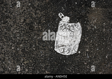 Crushed Soft Drink Can On Asphalt Manhattan Stock Photo