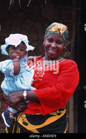 Friendly local woman poses for a portrait with her baby girl Chole island Mafia south of Zanzibar Tanzania East Africa Stock Photo