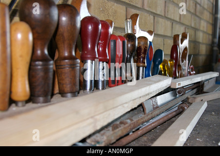 Craftsman's tools in a tool rack Stock Photo