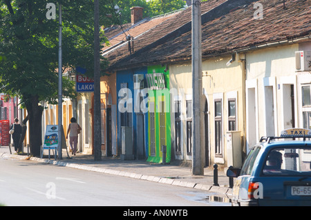 On the boulevard Ivana Cronjevica. Shops in small colourful houses. One shop with a sign saying 'New Industry'. Podgorica capital. Montenegro, Balkan, Europe. Stock Photo