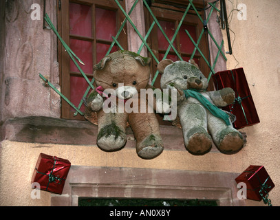 Two Teddy Bears sitting on a window sill. Stock Photo