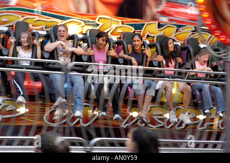 Girls enjoying a ride at St Giles fair in Oxford Stock Photo