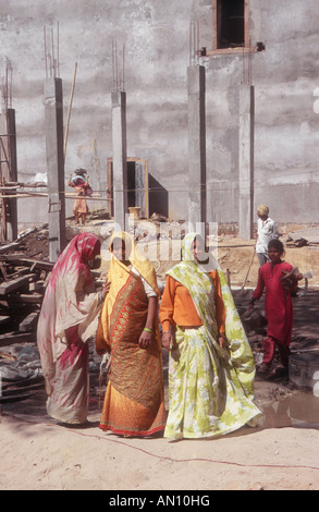Group of female construction workers on building site wearing traditional dress. India Stock Photo
