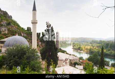 View over the town with mosque and church towers. River Neretva. Pocitelj historic Muslim and Christian village near Mostar. Federation Bosne i Hercegovine. Bosnia Herzegovina, Europe. Stock Photo