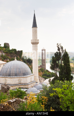 View over the town with mosque and church towers. River Neretva. Pocitelj historic Muslim and Christian village near Mostar. Federation Bosne i Hercegovine. Bosnia Herzegovina, Europe. Stock Photo