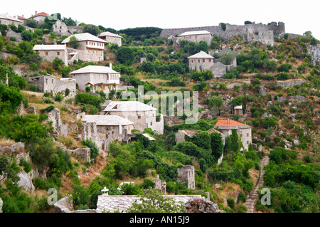 View over the town with mosque and church towers. River Neretva.. House ruins on the hillside. Pocitelj historic Muslim and Christian village near Mostar. Federation Bosne i Hercegovine. Bosnia Herzegovina, Europe. Stock Photo