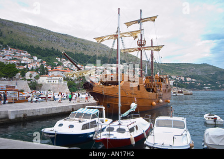 The Karaka 16 century galleon replica boat in the old harbour. Other boats moored. Dubrovnik, old city. Dalmatian Coast, Croatia, Europe. Stock Photo
