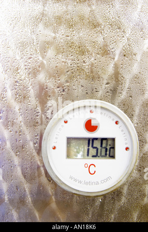 The winery with modern stainless steel fermentation tanks. Detail of thermometer showing 15 degrees centigrade, with condensation water drips. Letina make. Toreta Vinarija Winery in Smokvica village on Korcula island. Vinarija Toreta Winery, Smokvica town. Peljesac peninsula. Dalmatian Coast, Croatia, Europe. Stock Photo