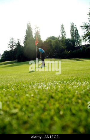 Golf Golfing Golfsport, close-up of a golf player hitting his ball at first hole Stock Photo