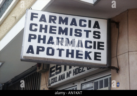 Multilingual sign for chemist shop in English, German, French and Spanish. Stock Photo