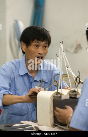 Chinese Workers Manufacturing Transformers In A Factory Shanghai Stock