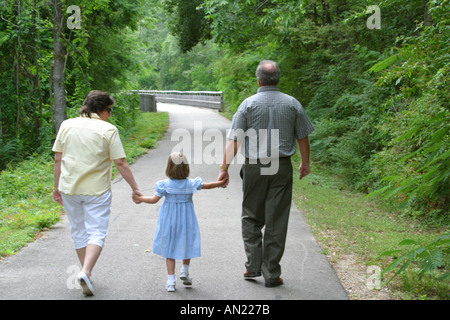 Louisiana Abita Springs,Tammany Trace,rail to trail conversion,family families parent parents child children,mother mom,father dad,walking,exercising, Stock Photo