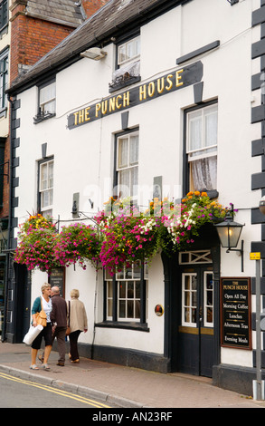 People walking past The Punch House Tavern in Monmouth Monmouthshire South Wales UK Stock Photo