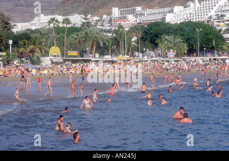 Puerto Rico, Gran Canaria, Canary Islands with people swimming in sea. Stock Photo