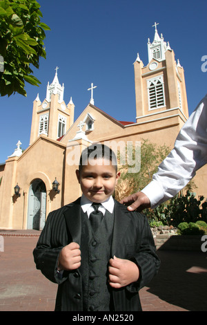 Albuquerque New Mexico,Old Town,San Felipe de Neri Church,religion,belief,faith,worship,House of God,Christian,built 1706,young boy,boys,child,Hispani Stock Photo