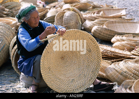 The Market / Woman making Cane Baskets, Dali, Yunnan Province, China Stock Photo