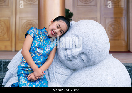 Young Girl / Child in Traditional Chinese Dress (Cheongsam), Beijing, China Stock Photo