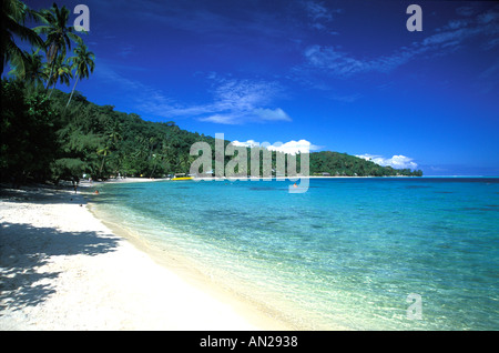 Crescent shaped beach with crystal clear waters of lagoon Bora Bora Stock Photo
