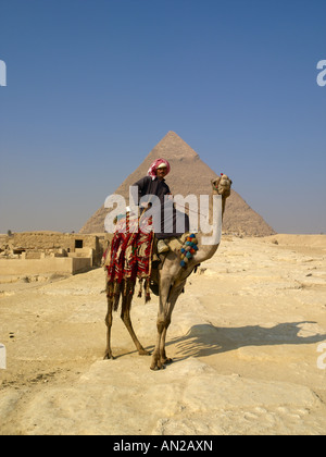 A camel rider in front of the Pyramids of Giza Stock Photo - Alamy