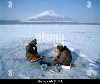 Mount Fuji / Lake Yamanaka / Frozen Lake with Fishermen, Honshu, Japan Stock Photo