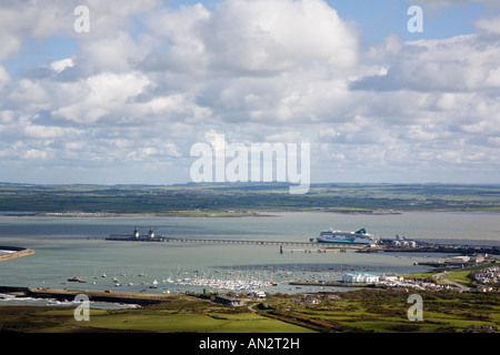 Elevated view of New harbour pier Irish Ferry terminal and coastline from Holyhead Mountain Holy Island Isle of Anglesey North Wales UK Britain Stock Photo