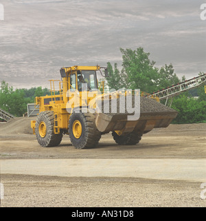 Heavy construction machine, front end loader moving along recycling ...