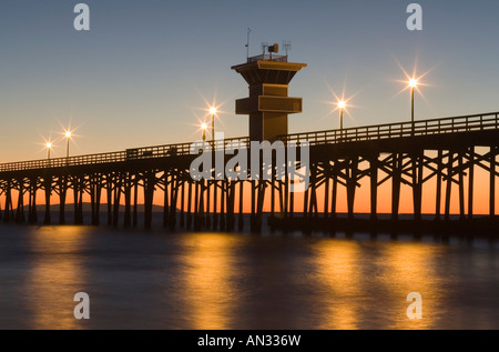 Sunset at Seal Beach Pier in Seal Beach, California USA.  Seal Beach is located in Orange County. Stock Photo