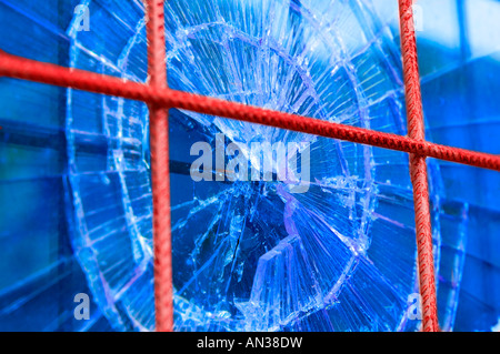broken window with security steel bars Stock Photo
