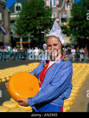 Cheese Market / Girl Dressed in Dutch Costume Holding Cheeses , Alkmaar, Holland Stock Photo