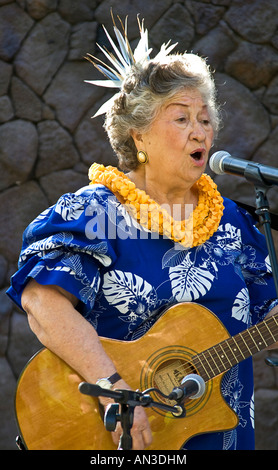 Hawaiian elder woman sings traditional songs Waikiki Hawaii Stock Photo