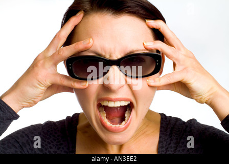 Face of stressed angry woman with scary expression Stock Photo - Alamy