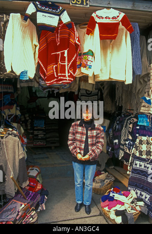 1, one, Chilean woman, adult woman, salesclerk, seller, selling, woolen clothes, souvenirs, clothing store, Puerto Montt, Chile, South America Stock Photo