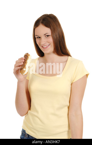 a teenage girl eating a cream cake Stock Photo