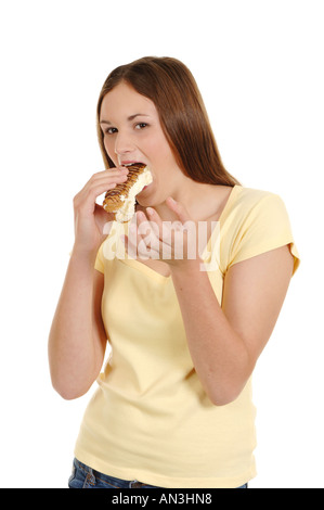 a teenage girl eating a cream cake Stock Photo