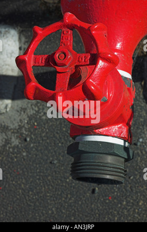 Red fire hydrants at industrial site Stock Photo